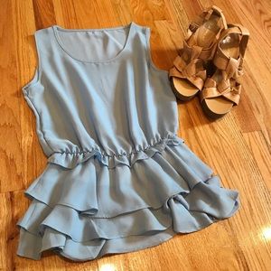 Francesca’s blue sleeveless ruffled peplum blouse